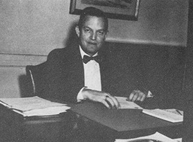 Dr. Ellis F. White at his desk