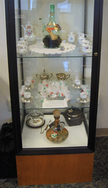 Glass case with wedding tea sets