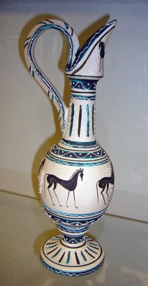 White vessel with horses painted on it