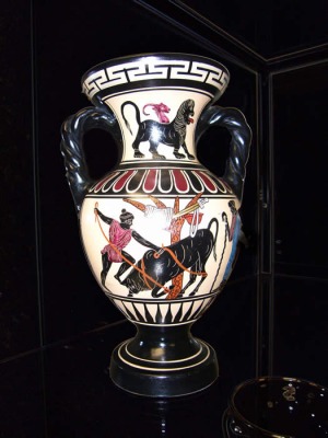 Black figure pottery with men fighting a bull