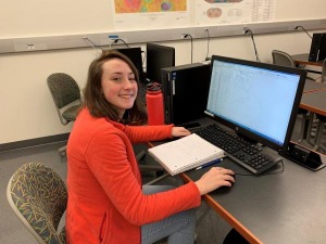 Caroline Anderson working at a computer