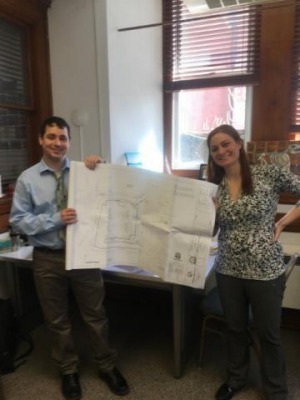 Ed Zink and Elizabeth Wood holding up plans