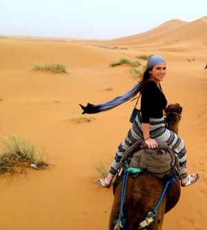 Sarina Cerro riding a camel in Morocco