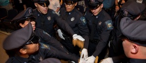 A group of students in the Police Program putting their hands together