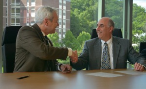 President Lapidus, right, and Superintendent Ravenelle after signing the updated honors compact