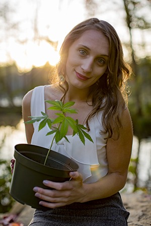 Hope Marian Redinger holding a marijuana plant