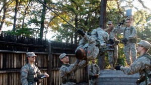 ROTC students doing a rope climbing exercise