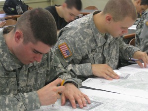 ROTC students working with maps
